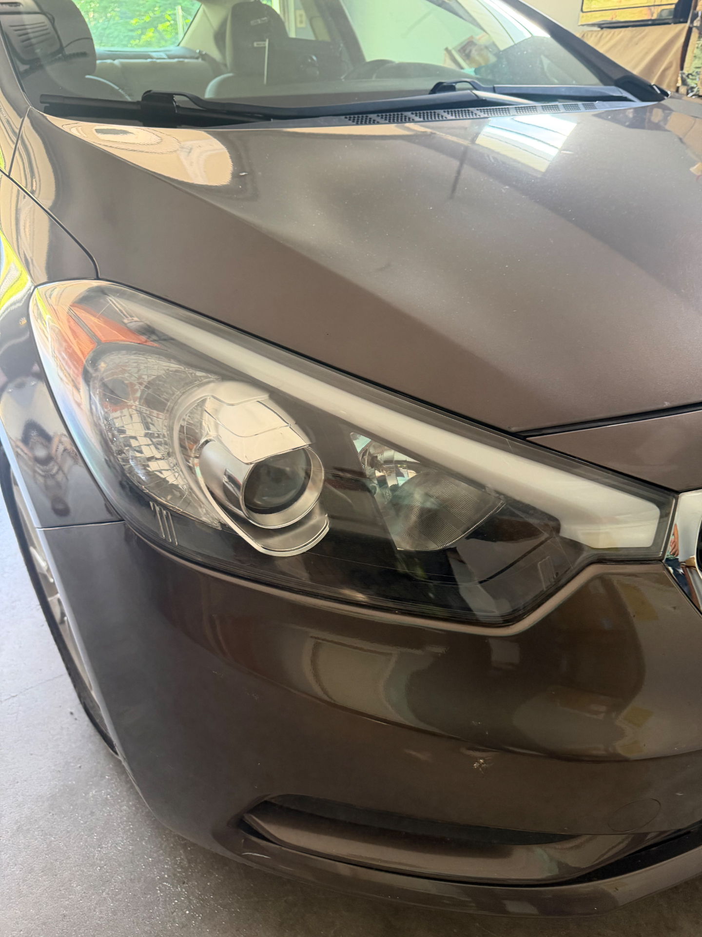 Restored clearer headlight on a brown crossover.